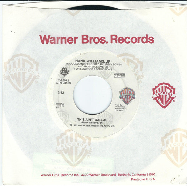 Hank Williams, Jr.* : This Ain't Dallas / I Really Like Girls (7", SRC)